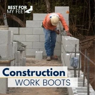 a construction worker laying out concrete blocks whilst wearing a good pair of safety work boots