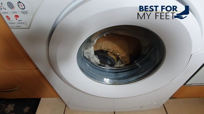 a pair of work boots being washed in the washing machine