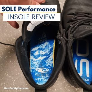 inserting a new pair of SOLE Performance ReCork insoles into a pair of work boots